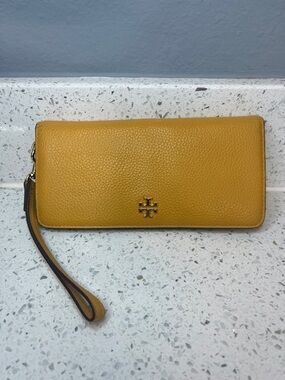 Tory Burch Pebbled Leather Wristlet in Mustard